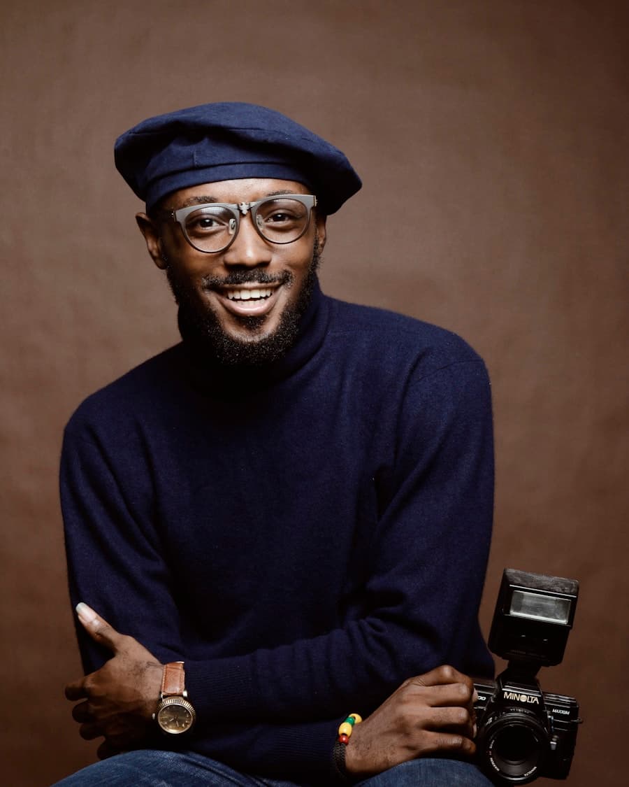 Black man with a warm, confident smile