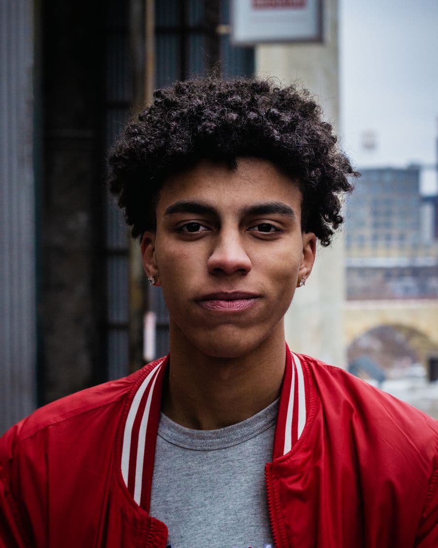 Young Black person with a calm, grounded presence
