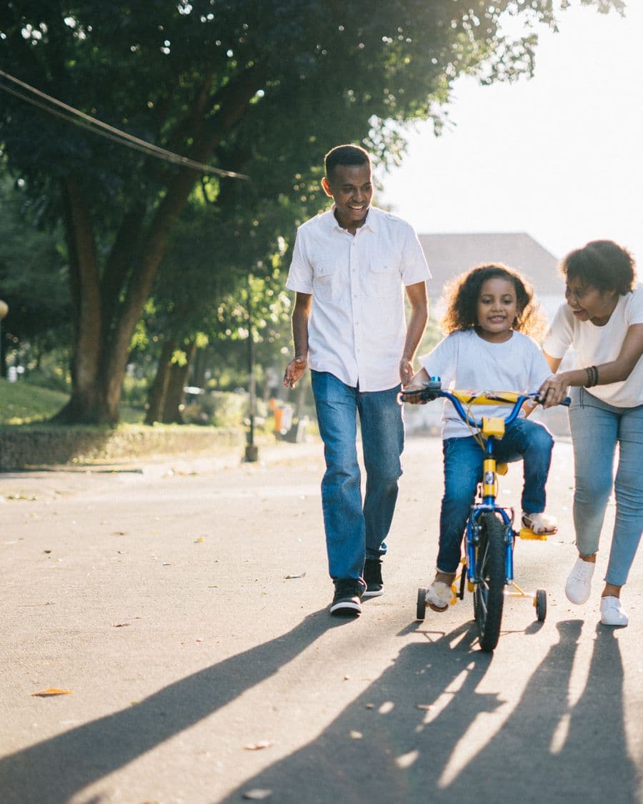 Black family sharing a joyful outdoor moment together