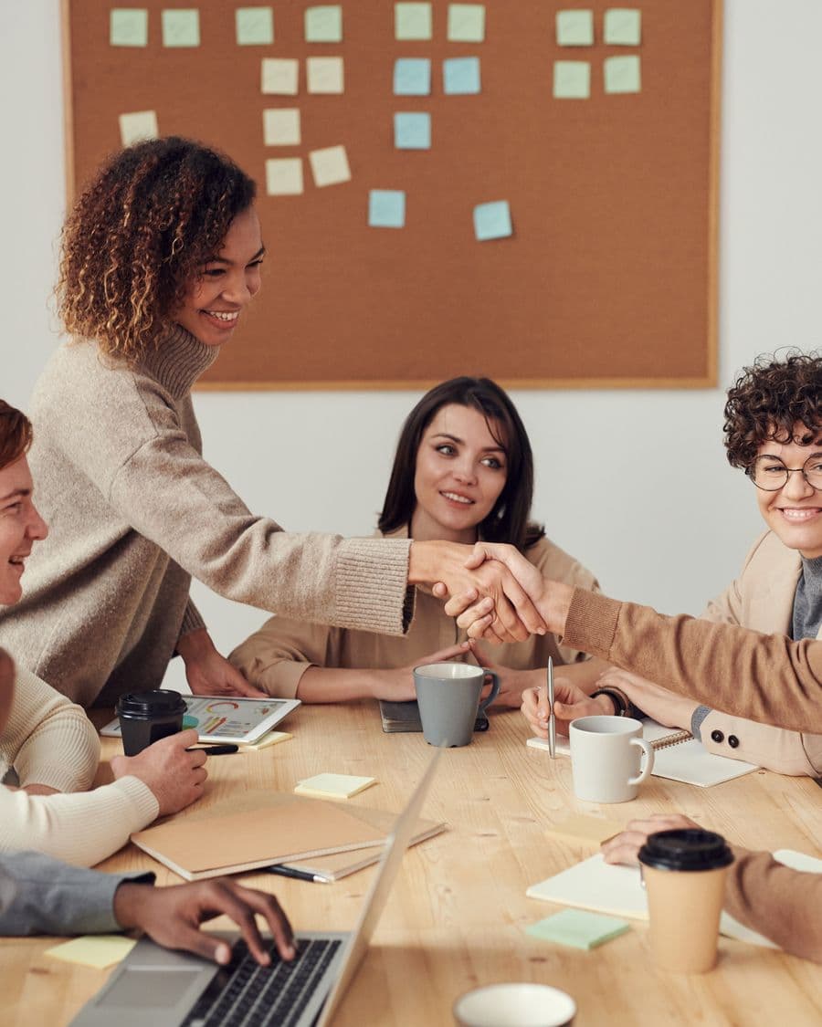 Diverse colleagues collaborating and connecting around a shared table