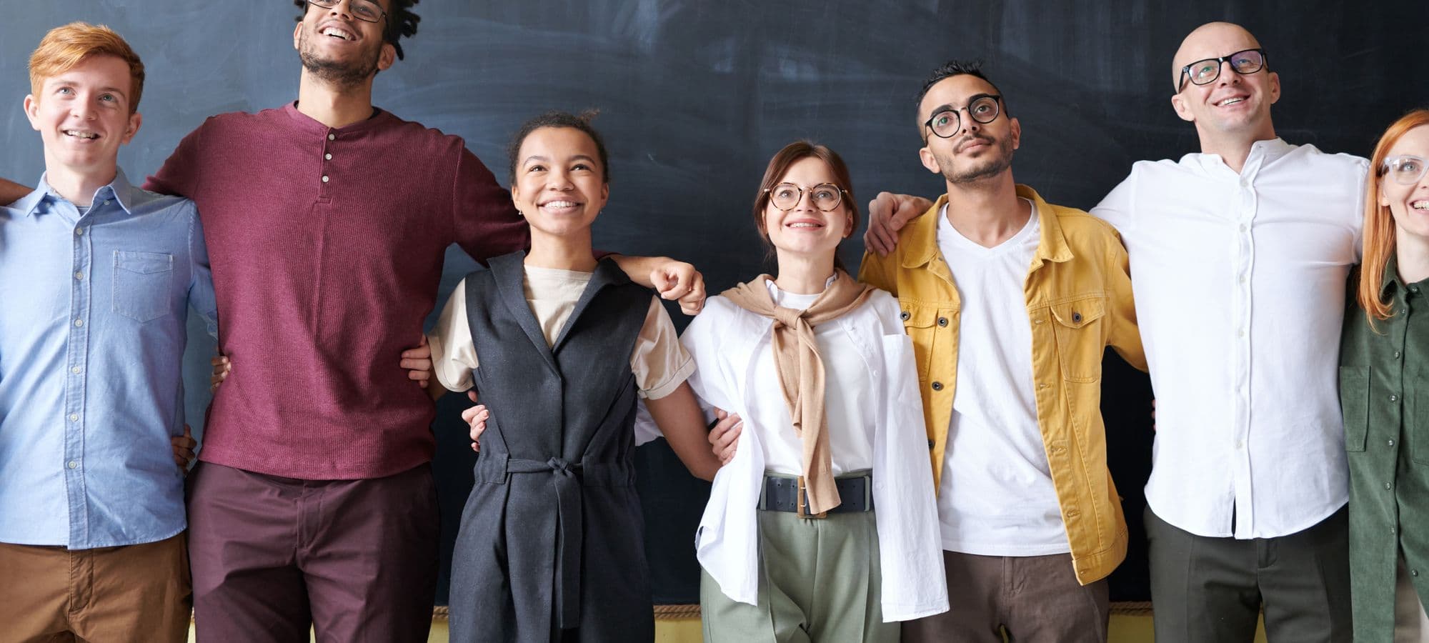 Diverse friends standing together with optimistic energy